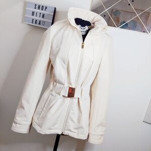 Cream coat with gold hardware and zipper